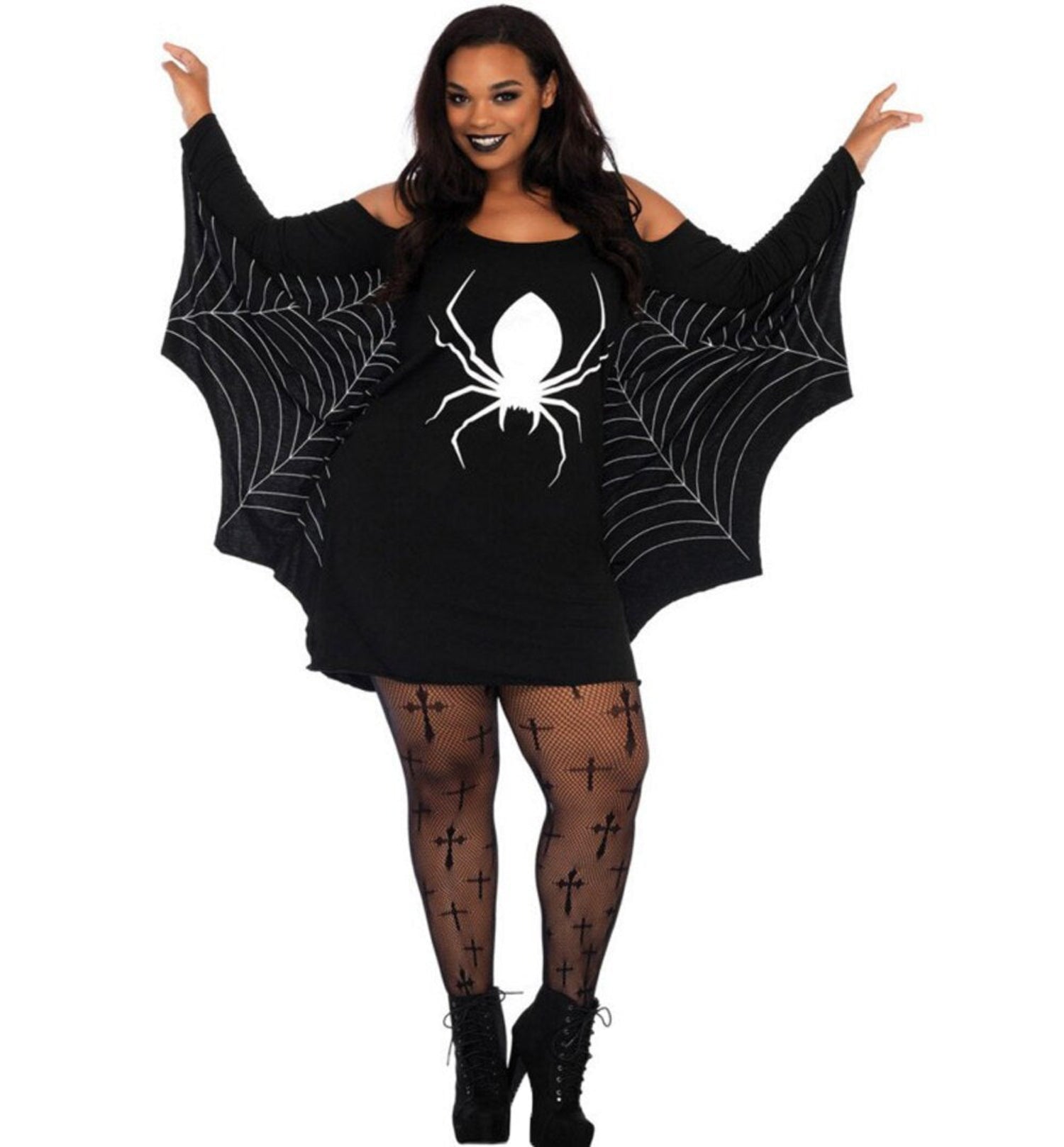 Woman wearing a black dress with spider web and spider design on a white background