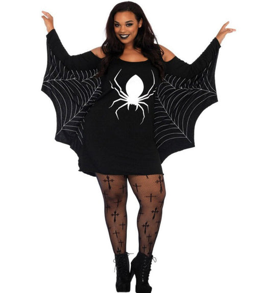 Woman wearing a black dress with spider web and spider design on a white background