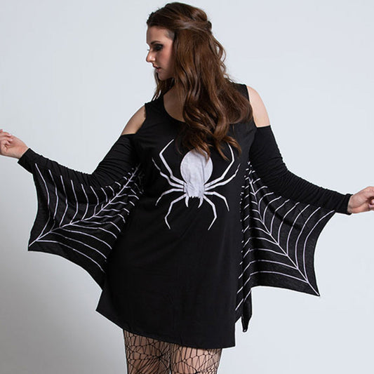 Black dress with spider design and spiderweb details worn by a model on a plain background